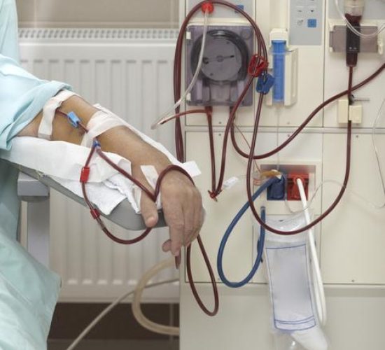 patient helped during dialysis session in hospital